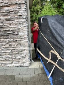 Moving a baby grand piano up the stairs