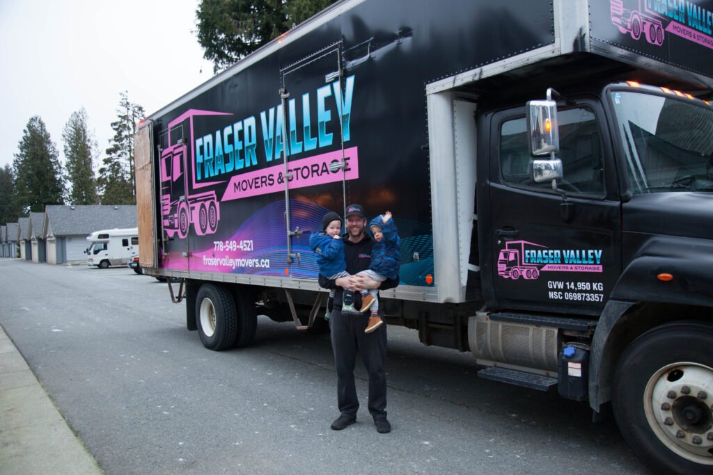 Jon and his boys in front of moving truck